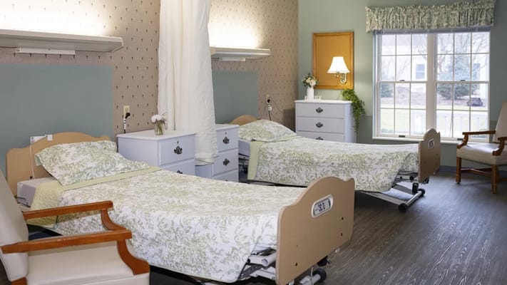 A well-decorated resident room with two beds