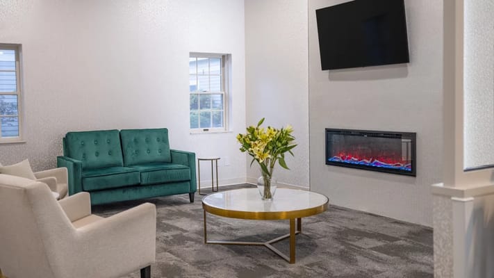 Cozy common area with seating and fireplace