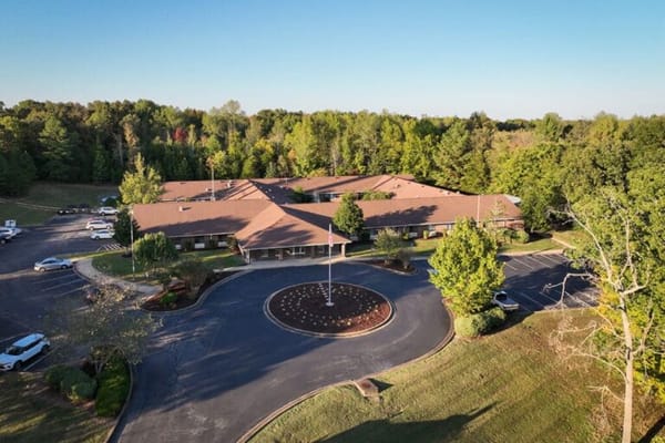 Aerial view of Waverly Hills Post Acute facility surrounded by trees
