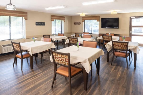Dining area with tables set for meals