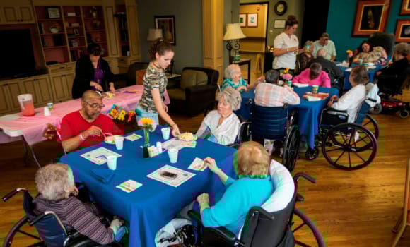 Residents enjoying a social activity with snacks