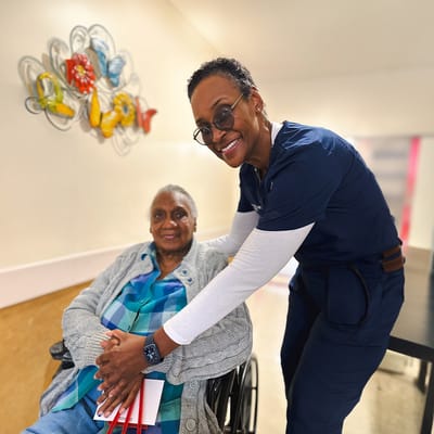 Staff member with resident in common area