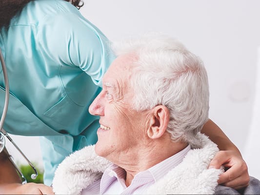 A caregiver interacting with a senior resident