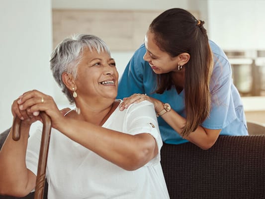 Staff member interacting with a resident in a common area