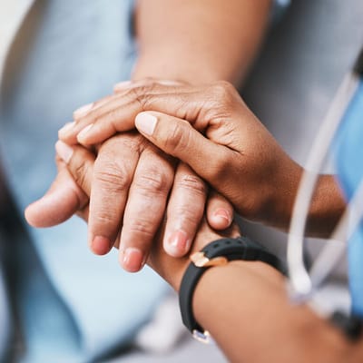 Close-up of two hands holding each other