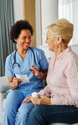 Nurse showing medication instructions to a resident
