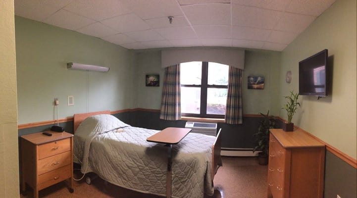 Private resident room with bed and window