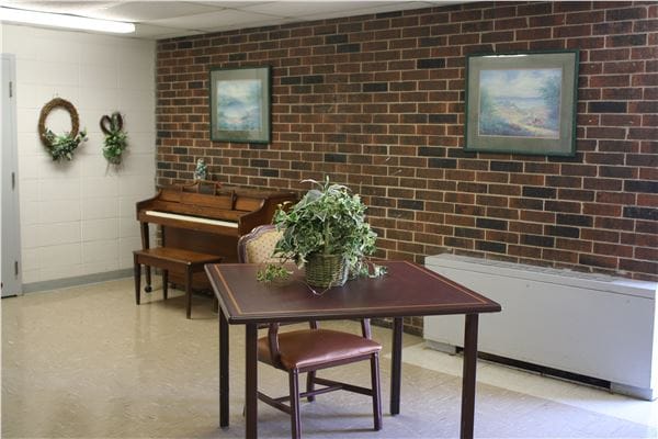 Interior view of a common area with a piano