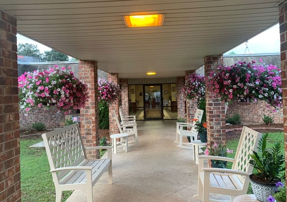 Outdoor seating area with flowers and plants