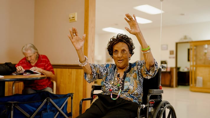 Residents engaging in a joyful activity in the facility