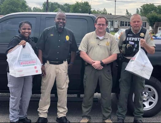 Community members delivering donuts to staff