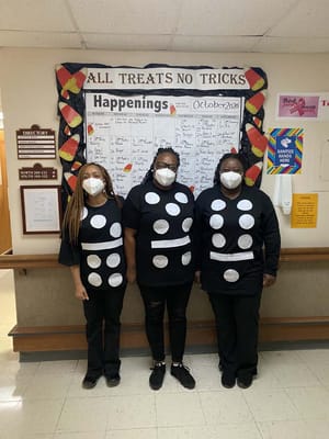 Staff in costume for Halloween activities