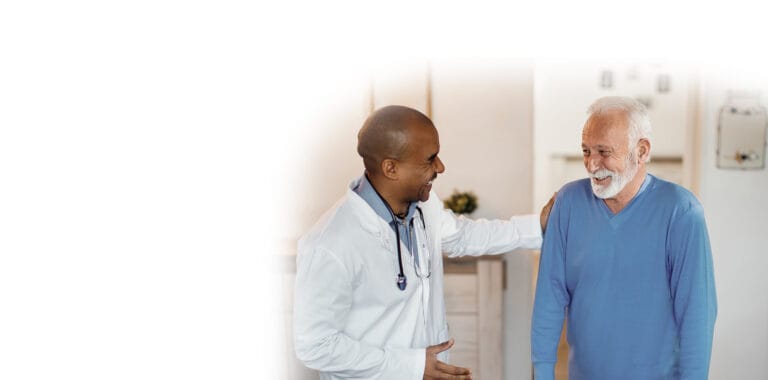 Healthcare professional interacting with a senior resident