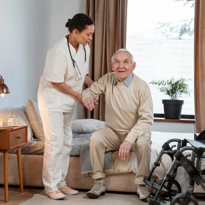 Staff assisting a resident in a cozy room