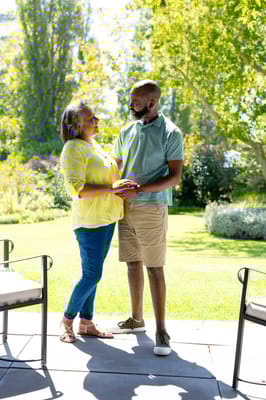 Two residents enjoying each other's company in a garden