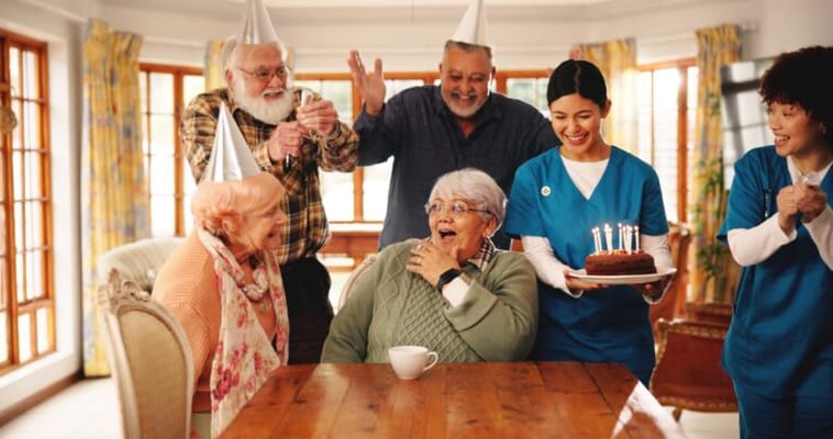 Celebration with residents and staff in a common area