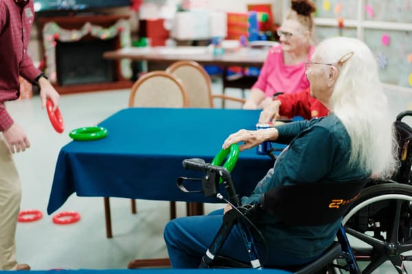 Residents engaged in a group activity at a table