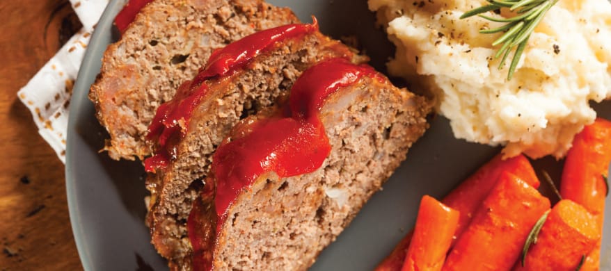 Plated meatloaf with mashed potatoes and carrots