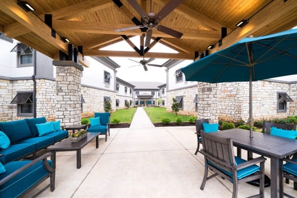 Outdoor seating area with pathway and landscaping