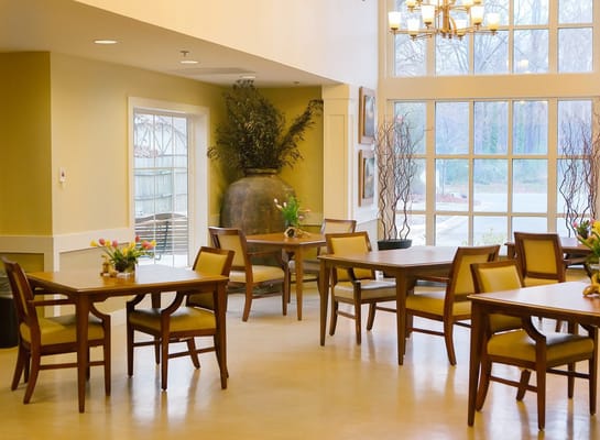 Bright dining room with tables and natural light