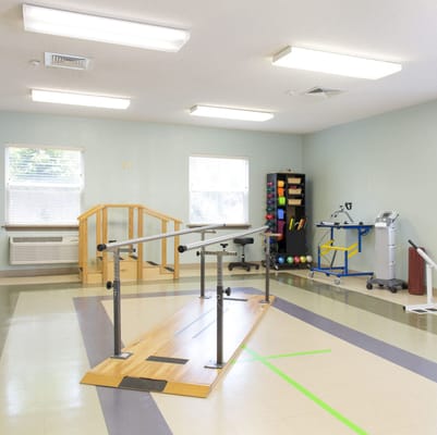 Therapy room with equipment and walking rails