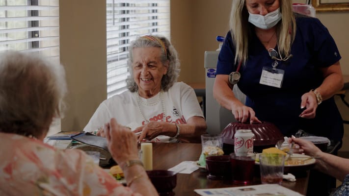 Residents enjoying a meal in a dining area