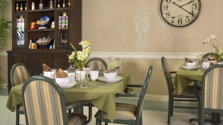 Dining area set with tables and food items