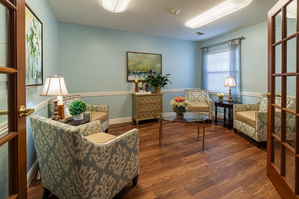 Cozy lounge area with comfortable seating and decorative art