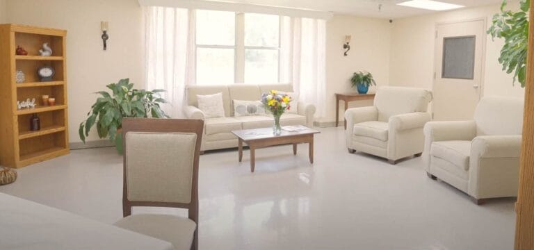 Bright common area with comfortable seating and plants