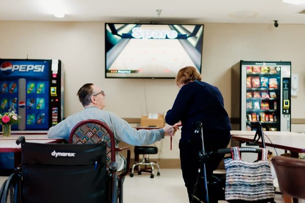 Residents enjoying each other's company in a cozy lounge