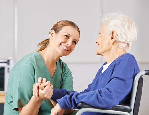 Caregiver and resident sharing a warm moment