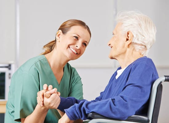 Healthcare worker engaging with a senior resident