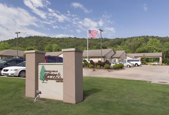 Front entrance of a senior care facility with landscaping