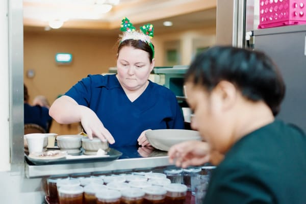 Staff preparing food in a busy kitchen