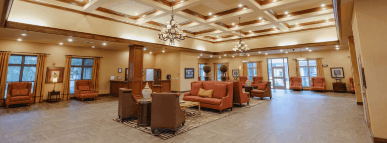 A spacious lobby area with seating and decorative lighting