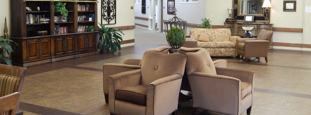 Interior common area with seating and bookshelves