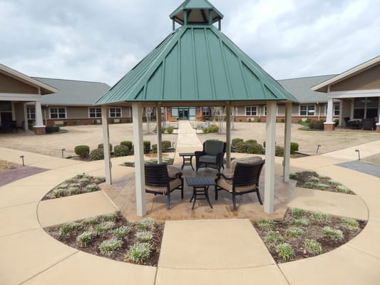 Outdoor gazebo with seating area in a senior living facility