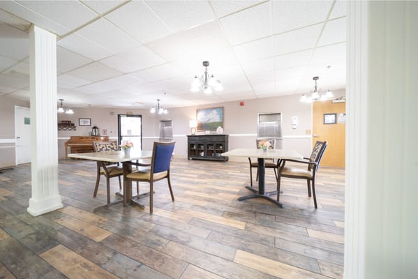 Bright dining area with tables and chairs