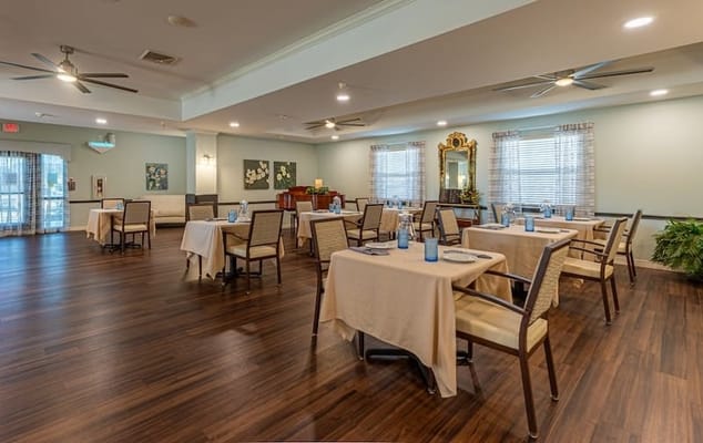 Bright dining room with tables set for meals