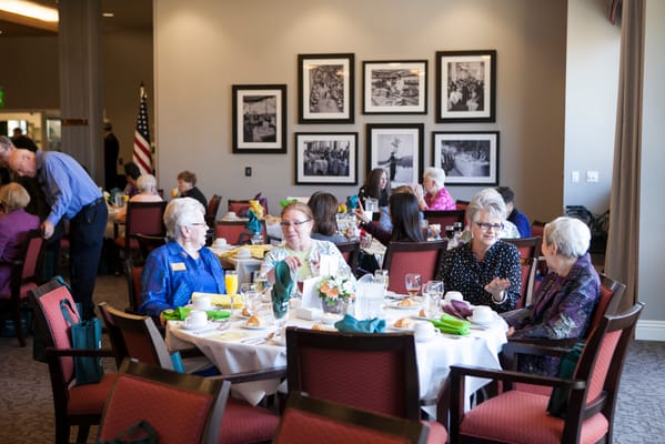 Residents enjoying a meal in the dining room