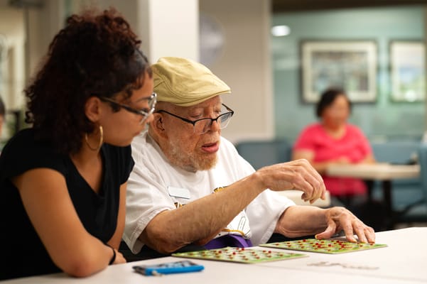 Residents playing bingo in a common area