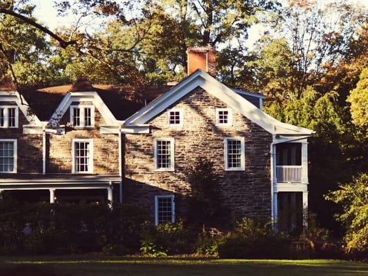Exterior view of a historic building surrounded by trees