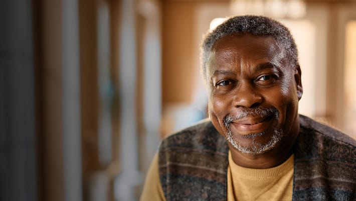 Smiling senior man in a cozy interior setting