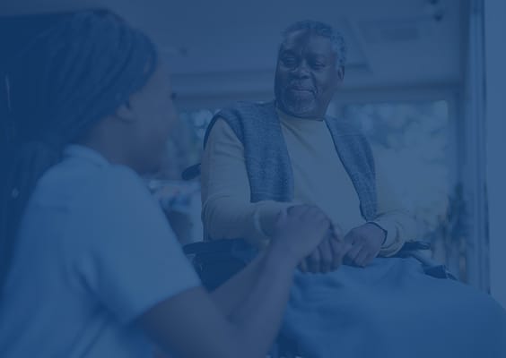 Resident and staff member engaging in conversation