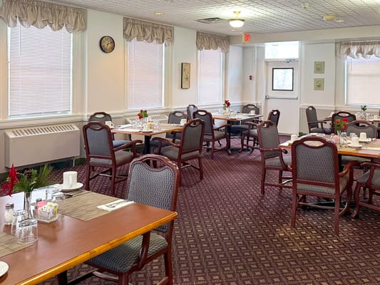 Dining room with tables set for residents