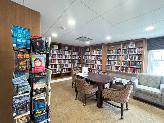Cozy library with bookshelves and reading areas
