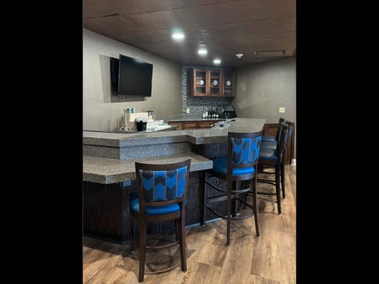 Interior view of a bar area with high chairs