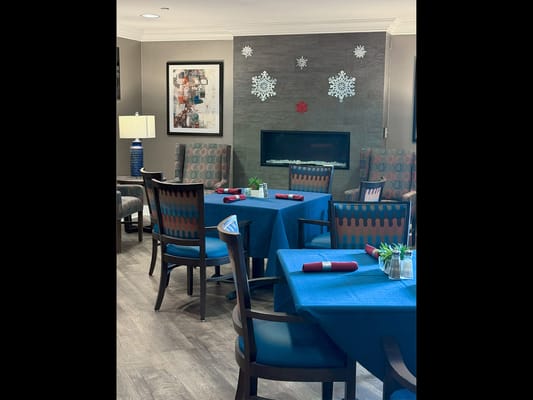Dining area with festive decorations and cozy seating