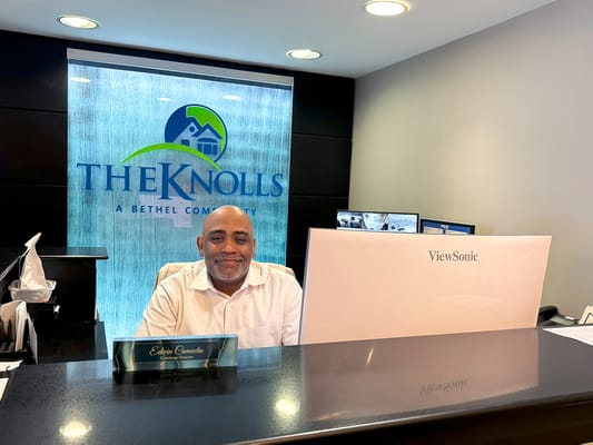 Reception area with a staff member at the front desk