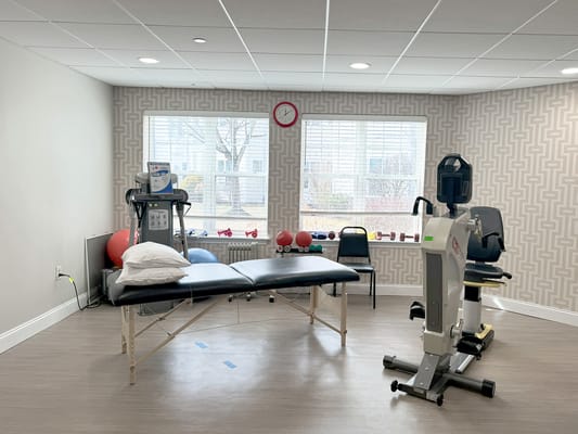 Rehabilitation therapy room with equipment and window